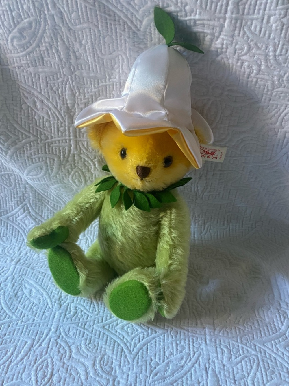 Plush Green Teddy with Yellow Face and White Flower Hat